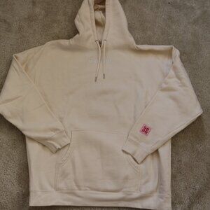 Glossier Off-White Hoodie with Pink Detail